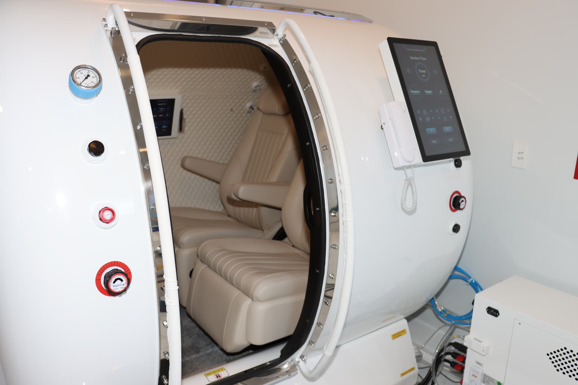 Close view of a chamber's leather seat and control screen